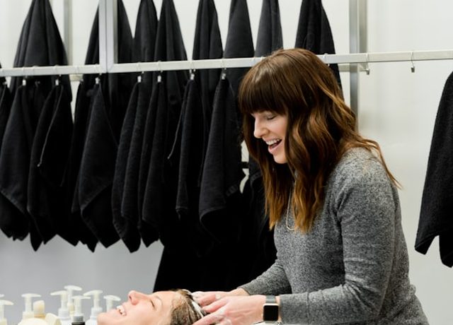 A practitioner attending to a booked client