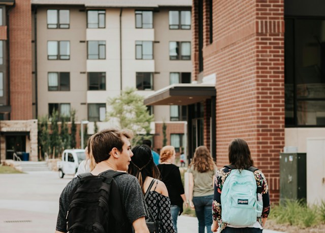 Students walking across a university campus