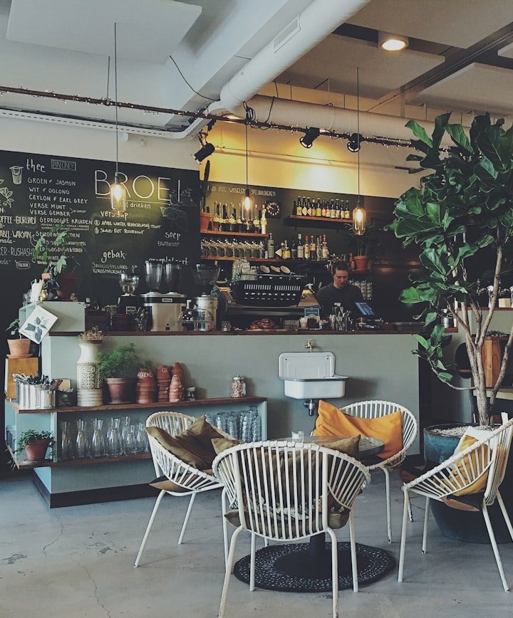The counter of a cafe, one of several branches